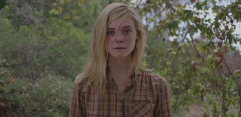 Movie still from “20th Century Women” (2016), directed by Mike Mills – A woman with blonde hair wearing a checkered shirt; Close Up shot, Low angle