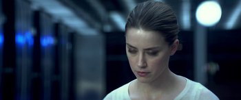 Movie still from “3 Days to Kill” (2014), directed by McG – A person looking down at her face; Close Up shot, Over the shoulder angle