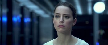 Movie still from “3 Days to Kill” (2014), directed by McG – A person wearing a white shirt; Close Up shot, Over the shoulder angle