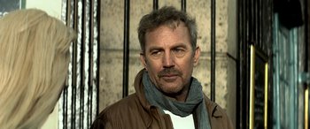 Movie still from “3 Days to Kill” (2014), directed by McG – A person wearing a jacket; Close Up shot, Low angle