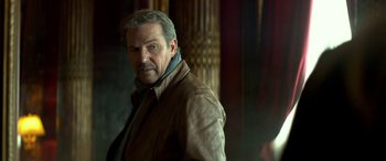 Movie still from “3 Days to Kill” (2014), directed by McG – A person wearing a jacket; Close Up shot, Over the shoulder angle