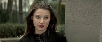 Movie still from “3 Days to Kill” (2014), directed by McG – A person with long hair; Close Up shot, Low angle