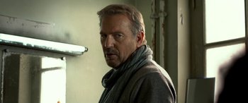 Movie still from “3 Days to Kill” (2014), directed by McG – A person wearing a sweater; Close Up shot, Low angle