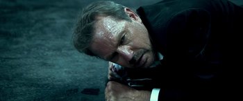 Movie still from “3 Days to Kill” (2014), directed by McG – A person laying on the ground; Close Up shot, Low angle