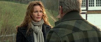 Movie still from “3 Days to Kill” (2014), directed by McG – A man and a woman are talking outside; Close Up shot, Over the shoulder angle