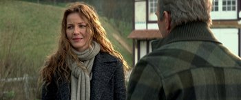 Movie still from “3 Days to Kill” (2014), directed by McG – A man and a woman standing next to each other; Close Up shot, Over the shoulder angle