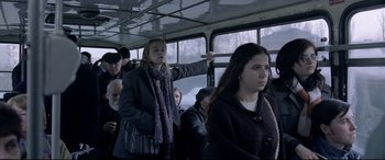 Movie still from “4 Months, 3 Weeks and 2 Days” (2007), directed by Cristian Mungiu – A group of people riding on a public transit bus; Medium shot, Low angle