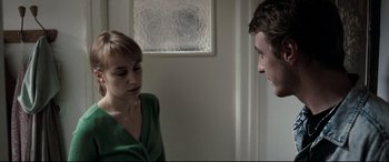 Movie still from “4 Months, 3 Weeks and 2 Days” (2007), directed by Cristian Mungiu – A man and a woman are talking in a room; Medium shot, Over the shoulder angle