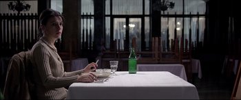 Movie still from “4 Months, 3 Weeks and 2 Days” (2007), directed by Cristian Mungiu – Two people sitting at a table in a restaurant; Medium shot, Over the shoulder angle