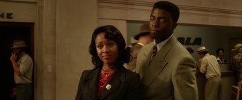 Movie still from “42” (2013), directed by Brian Helgeland – A man and a woman standing next to each other; Close Up shot, Over the shoulder angle