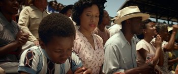 Movie still from “42” (2013), directed by Brian Helgeland – A group of people standing around each other in a crowd; Close Up shot, High angle