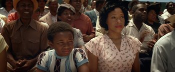 Movie still from “42” (2013), directed by Brian Helgeland – A group of people sitting in front of each other; Close Up shot, High angle