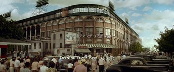 Movie still from “42” (2013), directed by Brian Helgeland – A group of people standing in front of a baseball stadium; Extreme Wide shot, High angle