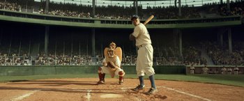 Movie still from “42” (2013), directed by Brian Helgeland – A baseball player is getting ready to hit a ball; Wide shot, High angle