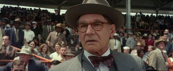 Movie still from “42” (2013), directed by Brian Helgeland – An older man in a suit and tie wearing a bow tie; Close Up shot, Over the shoulder angle