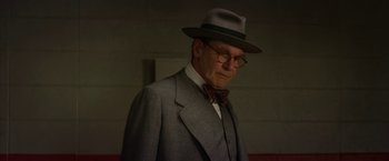 Movie still from “42” (2013), directed by Brian Helgeland – An older man wearing a suit and hat; Close Up shot, Low angle