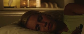 Movie still from “47 Meters Down” (2017), directed by Johannes Roberts – A woman laying in bed with her eyes closed; Close Up shot, High angle
