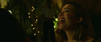 Movie still from “47 Meters Down” (2017), directed by Johannes Roberts – A woman laughing with her mouth open; Close Up shot, Low angle
