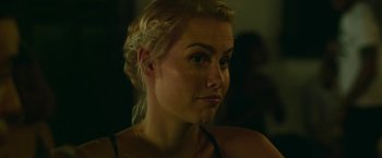 Movie still from “47 Meters Down” (2017), directed by Johannes Roberts – A beautiful blonde woman looking at the camera; Close Up shot, Over the shoulder angle