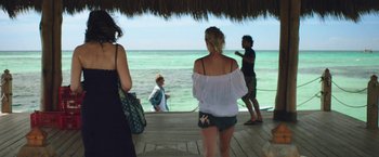 Movie still from “47 Meters Down” (2017), directed by Johannes Roberts – A group of people standing on a dock near the ocean; Wide shot, Over the shoulder angle