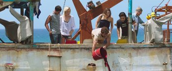 Movie still from “47 Meters Down” (2017), directed by Johannes Roberts – A group of people standing on top of a boat; Wide shot, High angle