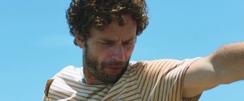 Movie still from “47 Meters Down” (2017), directed by Johannes Roberts – A person with curly brown hair; Close Up shot, Low angle