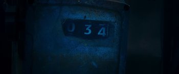 Movie still from “47 Meters Down” (2017), directed by Johannes Roberts – The number 0 3 4 on the side of an old car; Extreme Close Up shot, Overhead angle
