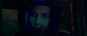 Movie still from “47 Meters Down” (2017), directed by Johannes Roberts – A person wearing a helmet and holding a remote control; Close Up shot, Over the shoulder angle