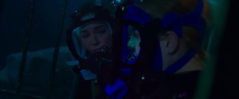 Movie still from “47 Meters Down” (2017), directed by Johannes Roberts – A man in a scuba mask looking at his reflection in a mirror; Close Up shot, Over the shoulder angle
