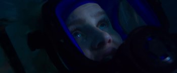 Movie still from “47 Meters Down” (2017), directed by Johannes Roberts – A woman with blue eyes looking into the camera; Extreme Close Up shot, Overhead angle