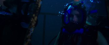 Movie still from “47 Meters Down” (2017), directed by Johannes Roberts – A person wearing a scuba mask in the water; Close Up shot, Over the shoulder angle