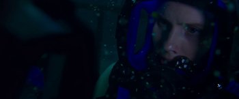 Movie still from “47 Meters Down” (2017), directed by Johannes Roberts – A person wearing a blue jacket in a dark room; Close Up shot, Over the shoulder angle