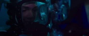 Movie still from “47 Meters Down” (2017), directed by Johannes Roberts – A man is reflected in the side view mirror of a car; Close Up shot, Overhead angle