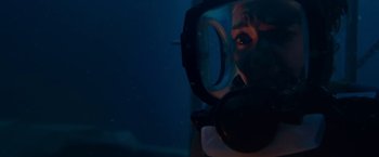 Movie still from “47 Meters Down” (2017), directed by Johannes Roberts – A person wearing a scuba mask in the water; Close Up shot, Overhead angle