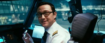 Movie still from “7500” (2019), directed by Patrick Vollrath – A man in a pilot's uniform sitting in the cockpit of an airplane; Close Up shot, Low angle