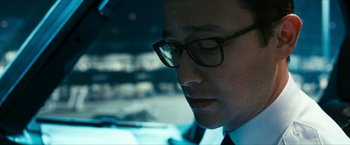 Movie still from “7500” (2019), directed by Patrick Vollrath – A person wearing glasses in a car; Close Up shot, Low angle