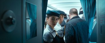 Movie still from “7500” (2019), directed by Patrick Vollrath – A group of people in uniforms on a train; Medium shot, Over the shoulder angle