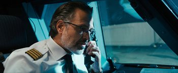 Movie still from “7500” (2019), directed by Patrick Vollrath – A person talking on a cell phone; Close Up shot, Low angle