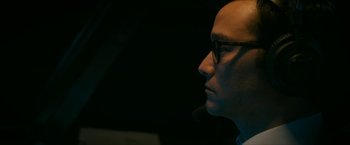 Movie still from “7500” (2019), directed by Patrick Vollrath – A man with glasses looking to the side; Close Up shot, Low angle