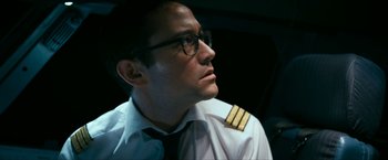 Movie still from “7500” (2019), directed by Patrick Vollrath – A man wearing a white shirt and black tie; Close Up shot, Low angle