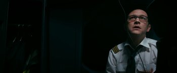 Movie still from “7500” (2019), directed by Patrick Vollrath – A man in a white shirt and a tie; Medium shot, Low angle