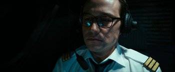 Movie still from “7500” (2019), directed by Patrick Vollrath – A man wearing a pilot's uniform and a tie; Close Up shot, Low angle