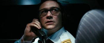 Movie still from “7500” (2019), directed by Patrick Vollrath – A man in a uniform talking on a cell phone; Close Up shot, Low angle