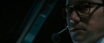 Movie still from “7500” (2019), directed by Patrick Vollrath – A man wearing a headset and a microphone; Close Up shot, Low angle