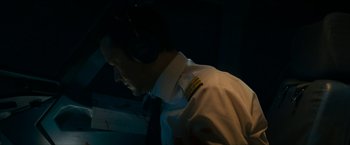 Movie still from “7500” (2019), directed by Patrick Vollrath – A man wearing a uniform and a tie; Medium shot, Low angle