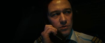 Movie still from “7500” (2019), directed by Patrick Vollrath – A person talking on a cell phone; Close Up shot, Low angle