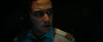 Movie still from “7500” (2019), directed by Patrick Vollrath – A person wearing a pilot's uniform; Close Up shot, High angle