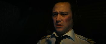 Movie still from “7500” (2019), directed by Patrick Vollrath – A person wearing a shirt and a tie; Close Up shot, High angle