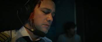 Movie still from “7500” (2019), directed by Patrick Vollrath – A man with blood all over his face; Close Up shot, Low angle