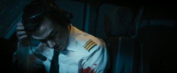 Movie still from “7500” (2019), directed by Patrick Vollrath – A man in a uniform with blood on his face; Close Up shot, High angle